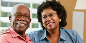 Older African American couple smiling